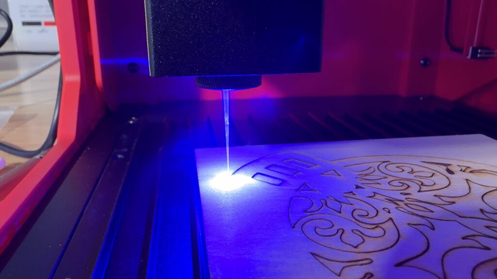 A diode laser vaporizing wood as it cuts